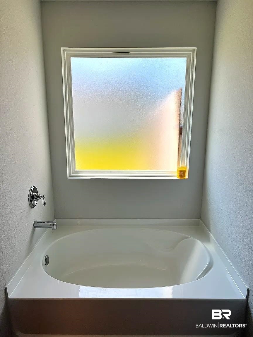 23915 Veranda Circle Elberta, AL 36530 - Photo 14 of 16 Full bathroom with a textured wall and a bath