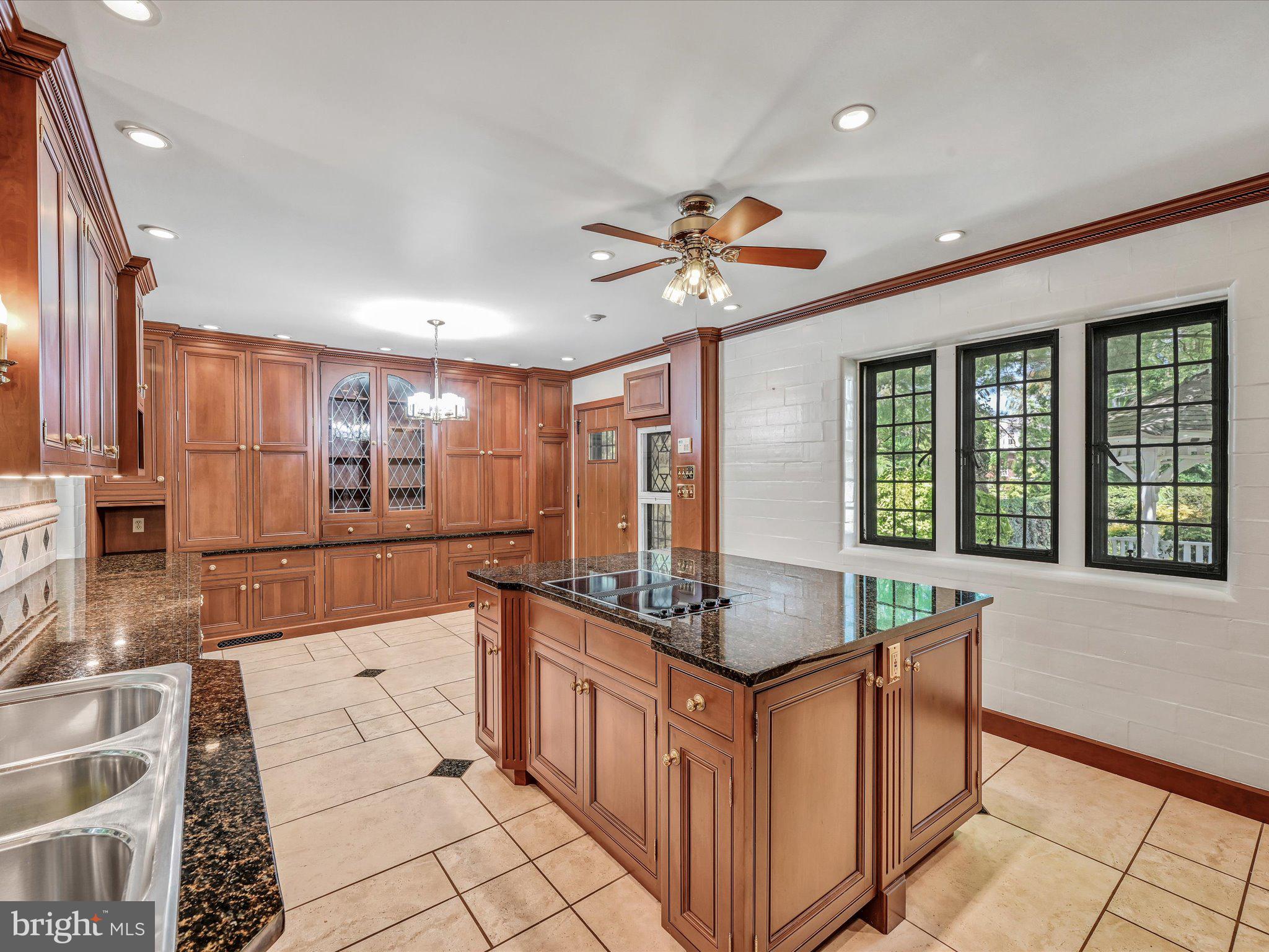 405 North Tulpehocken Road Reading, PA 19601 - Photo 16 of 111 a large kitchen with kitchen island granite countertop a large counter top space a sink a window and stainless steel appliances