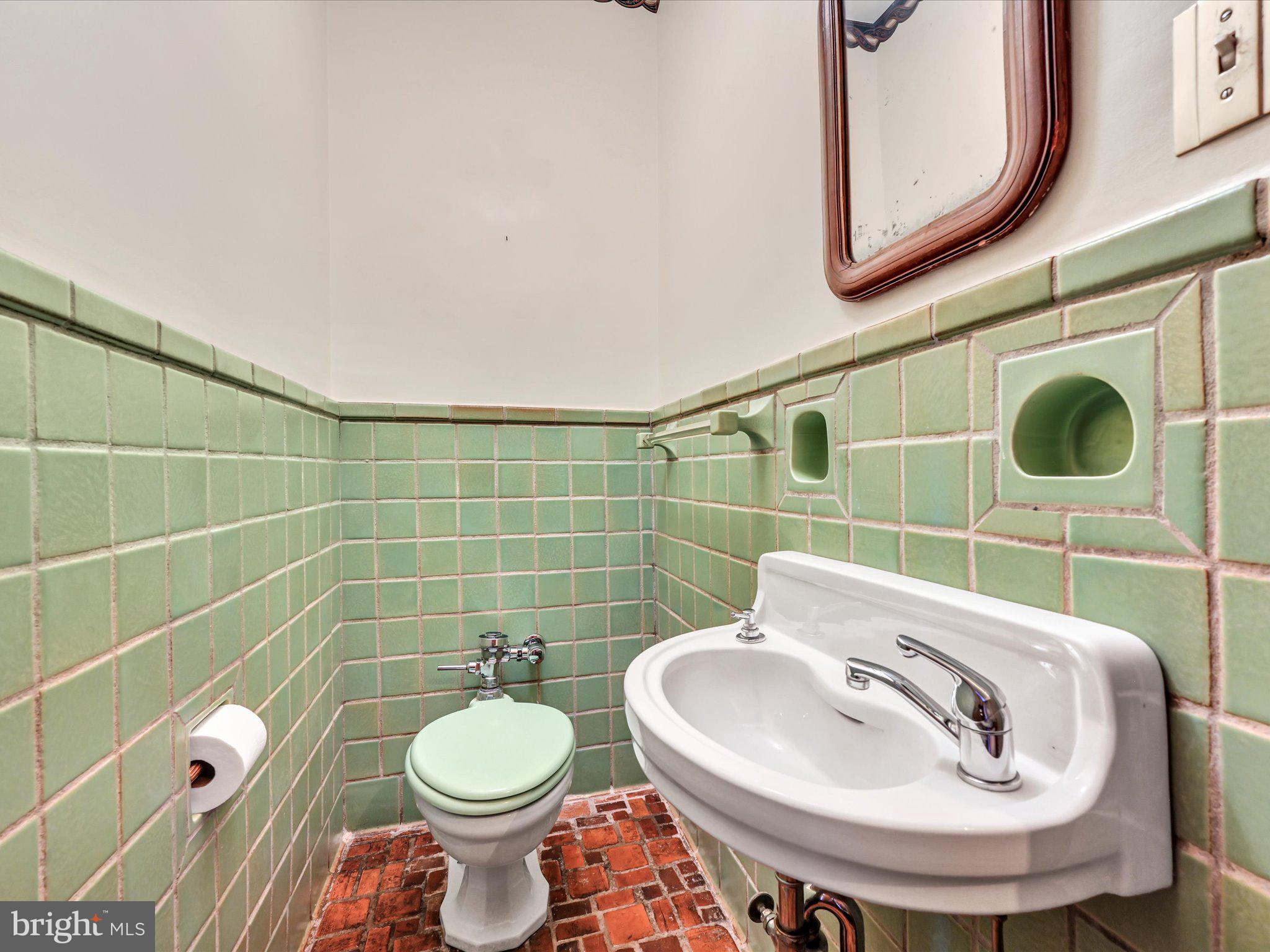 405 North Tulpehocken Road Reading, PA 19601 - Photo 21 of 111 a bathroom with a sink a toilet and a mirror