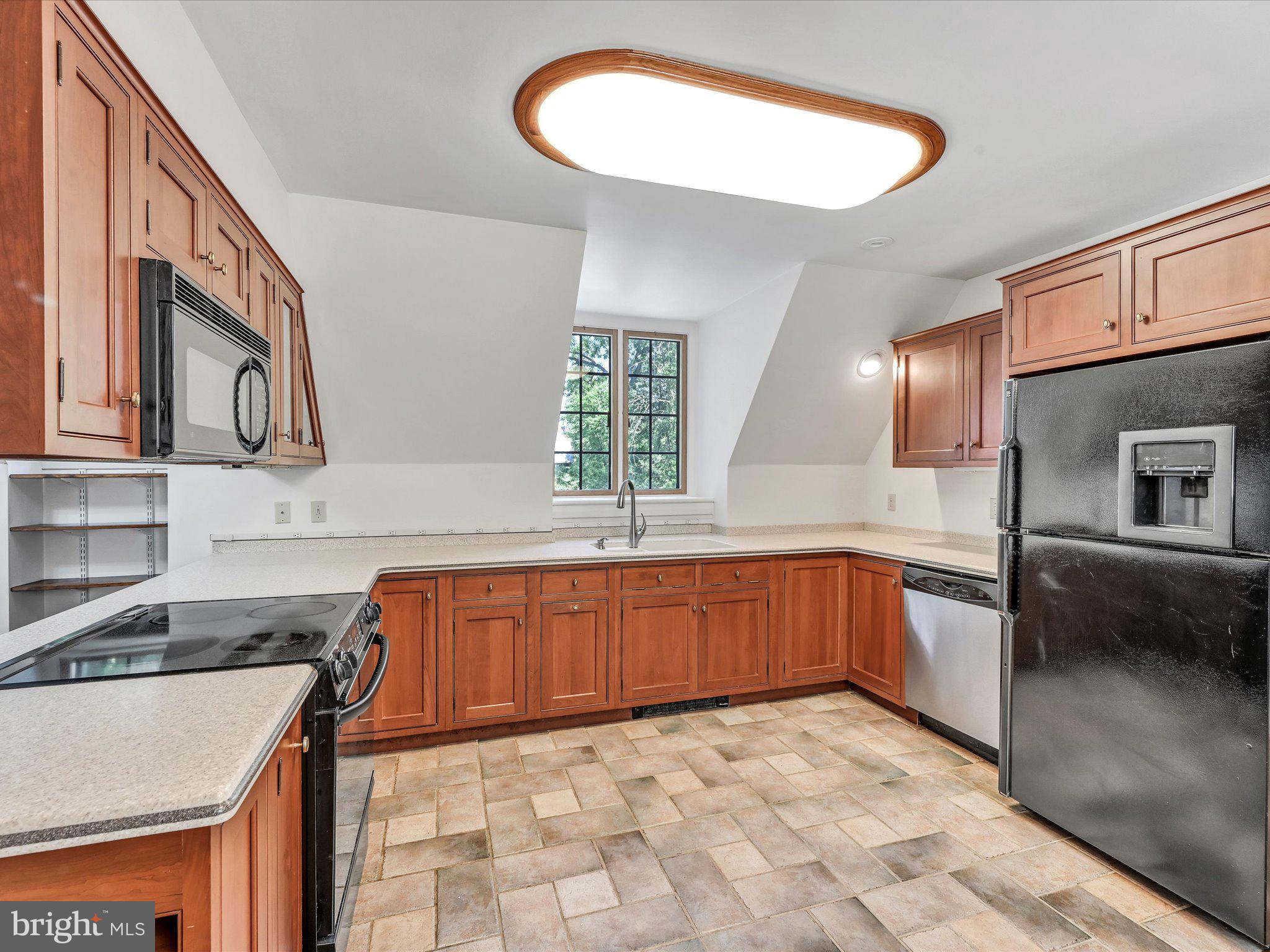 405 North Tulpehocken Road Reading, PA 19601 - Photo 53 of 111 a kitchen with stainless steel appliances granite countertop a sink and cabinets