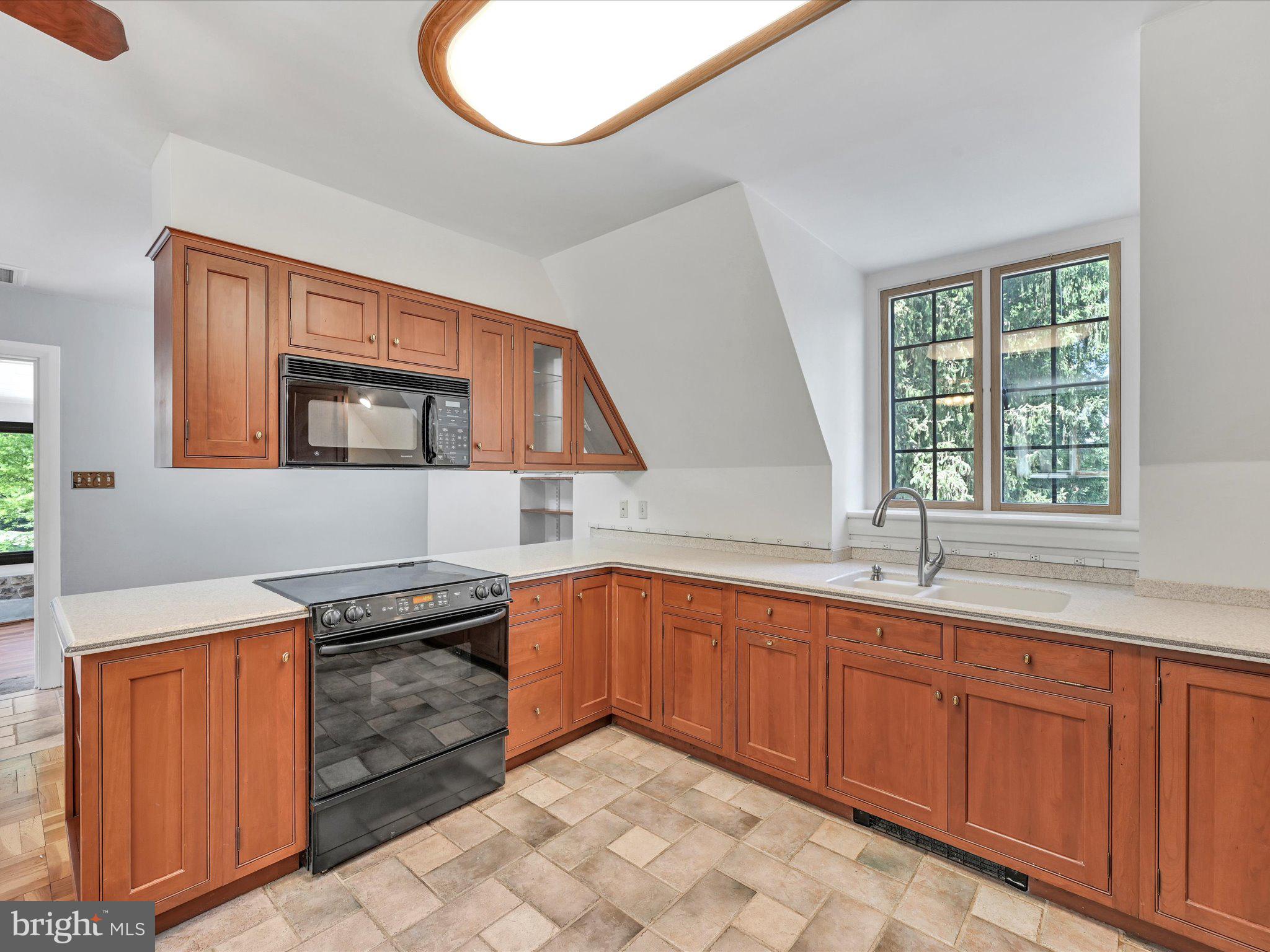 405 North Tulpehocken Road Reading, PA 19601 - Photo 54 of 111 a kitchen with stainless steel appliances granite countertop a sink and a stove