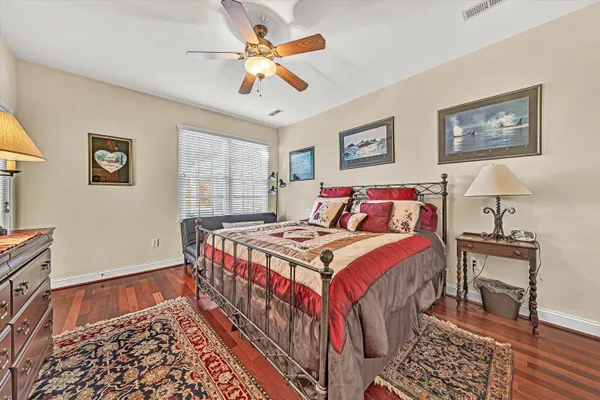 a bedroom with a bed and a table in it