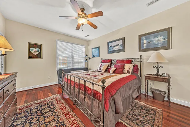 a bedroom with a bed and a table in it