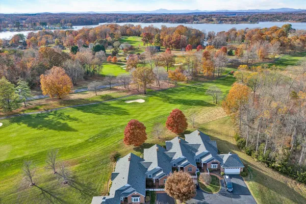 an aerial view of a house with yard swimming pool and outdoor seating