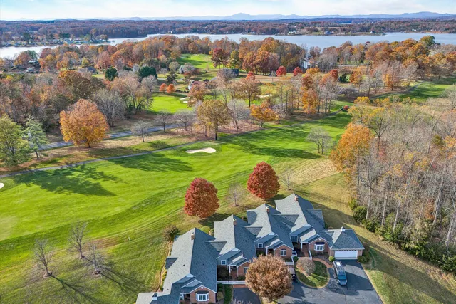 an aerial view of a house with yard swimming pool and outdoor seating