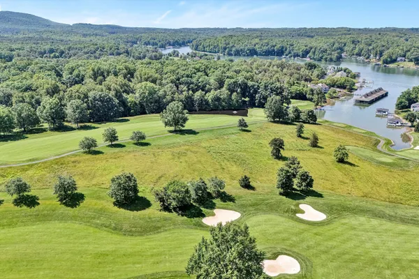 an aerial view of a houses with yard