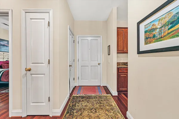 a view of bedroom with a bed and a rug