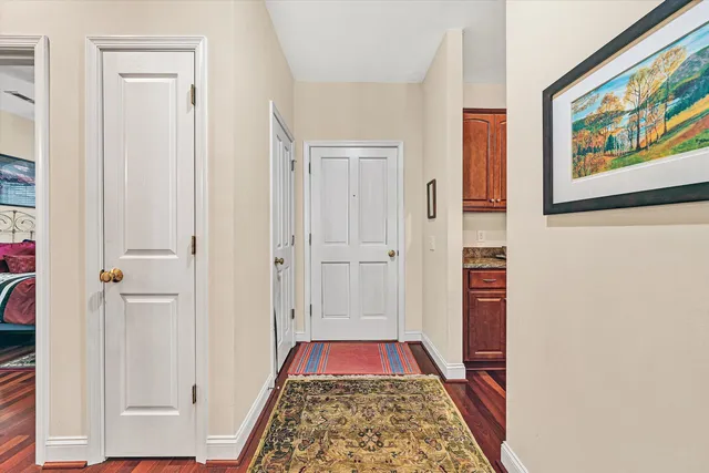 a view of bedroom with a bed and a rug