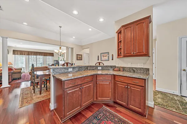 a kitchen with a sink stove and wooden cabinets