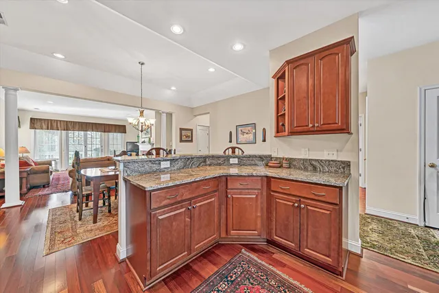 a kitchen with a sink stove and wooden cabinets