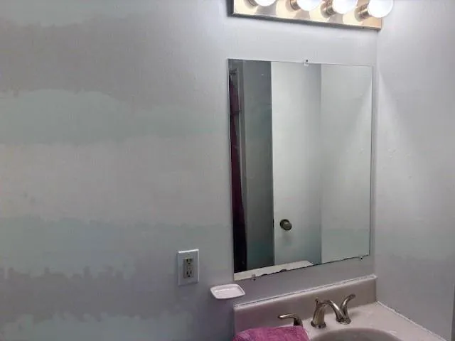 a bathroom with a bathtub and a sink