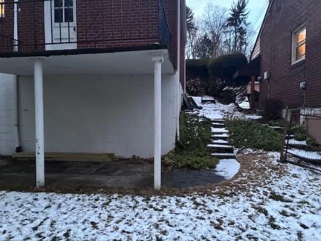 a view of a patio with table and chairs and potted plants