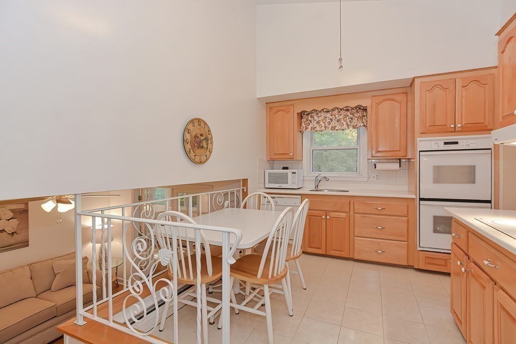 23 Edward Street Canton, MA 02021 - Photo 13 of 40 a kitchen with stainless steel appliances granite countertop a stove a sink and a granite countertops with cabinets