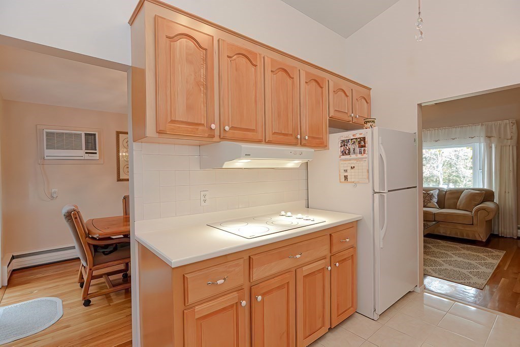 23 Edward Street Canton, MA 02021 - Photo 15 of 40 a kitchen with a cabinets and chairs