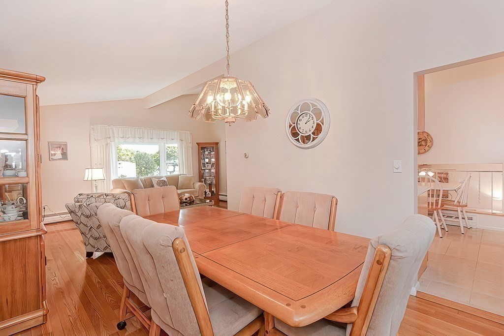23 Edward Street Canton, MA 02021 - Photo 17 of 40 a view of a dining room with furniture wooden floor and chandelier