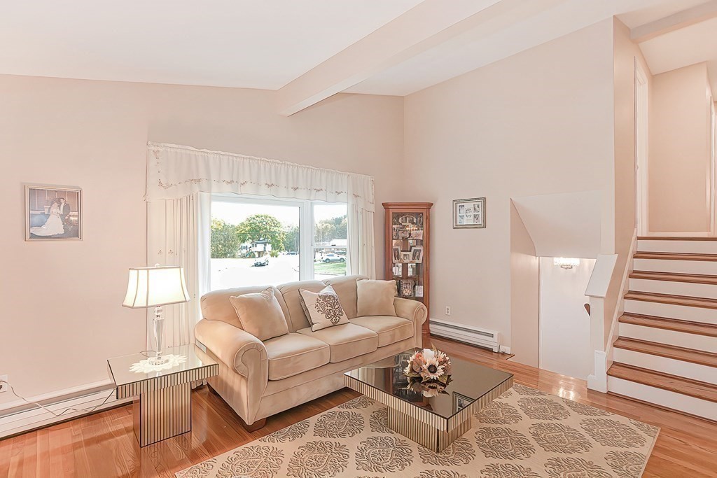 23 Edward Street Canton, MA 02021 - Photo 18 of 40 a living room with furniture and a large window