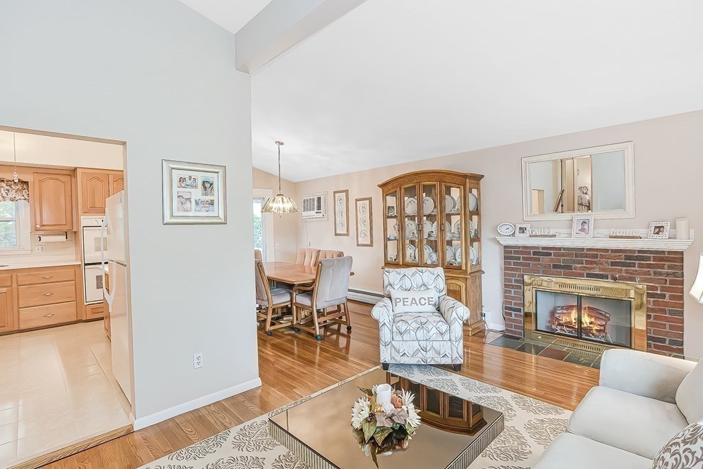 23 Edward Street Canton, MA 02021 - Photo 20 of 40 a living room with furniture and a fireplace