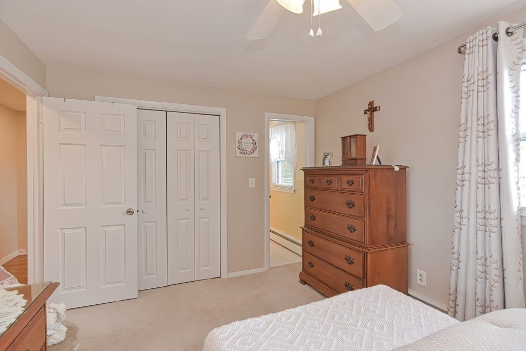 23 Edward Street Canton, MA 02021 - Photo 26 of 40 a bedroom with a bed and a dresser