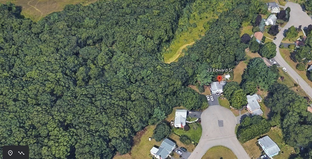 23 Edward Street Canton, MA 02021 - Photo 35 of 40 an aerial view of a house with table chairs and potted plants