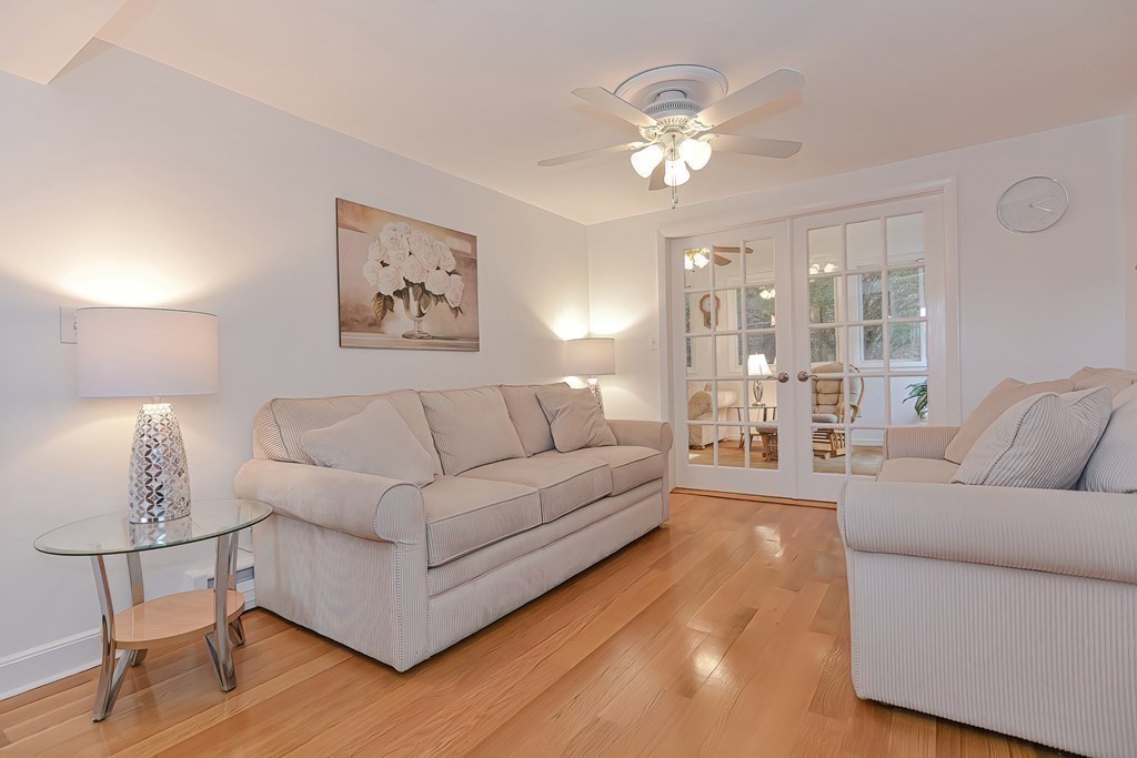 23 Edward Street Canton, MA 02021 - Photo 5 of 40 a living room with furniture and a chandelier
