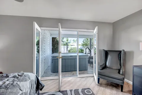 a bedroom with a bed and a chandelier