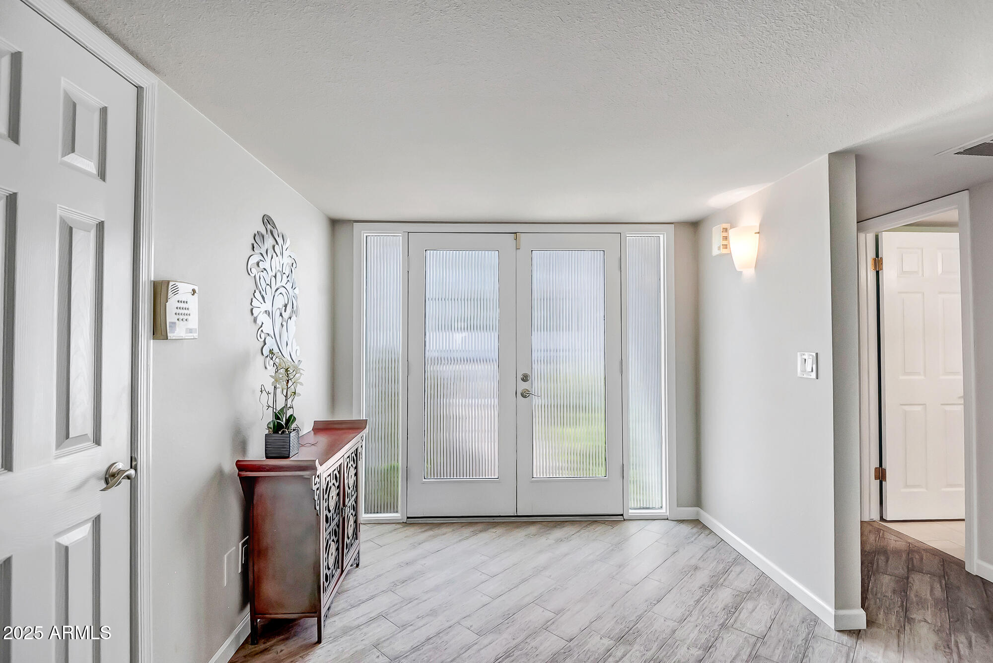 110 East Piping Rock Road Phoenix, AZ 85022 - Photo 4 of 37 a view of a room with wooden floor and windows