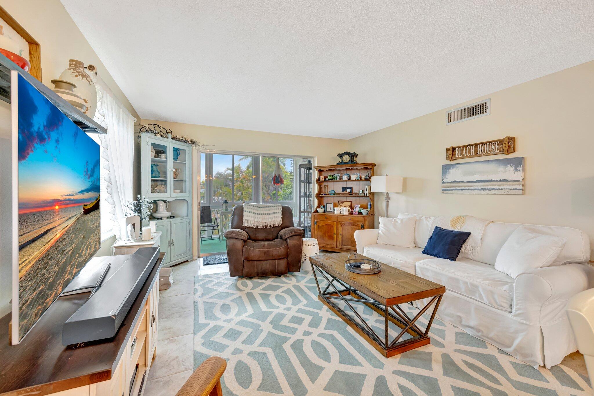 2950 Southeast Ocean Boulevard, Unit 1345 Stuart, FL 34996 - Photo 13 of 52 Living Room to Lanai View