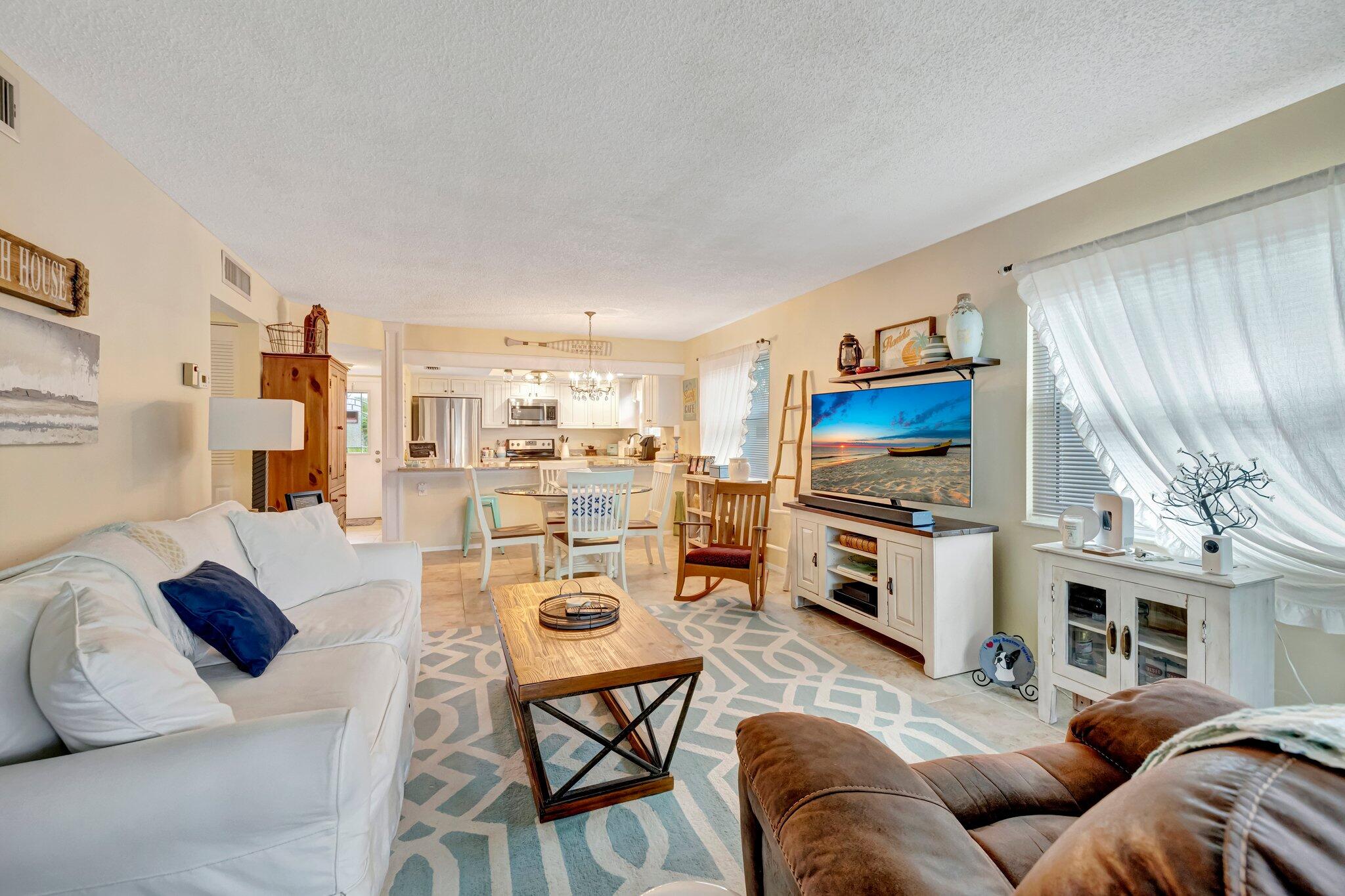 2950 Southeast Ocean Boulevard, Unit 1345 Stuart, FL 34996 - Photo 14 of 52 Living Room to Kitchen View