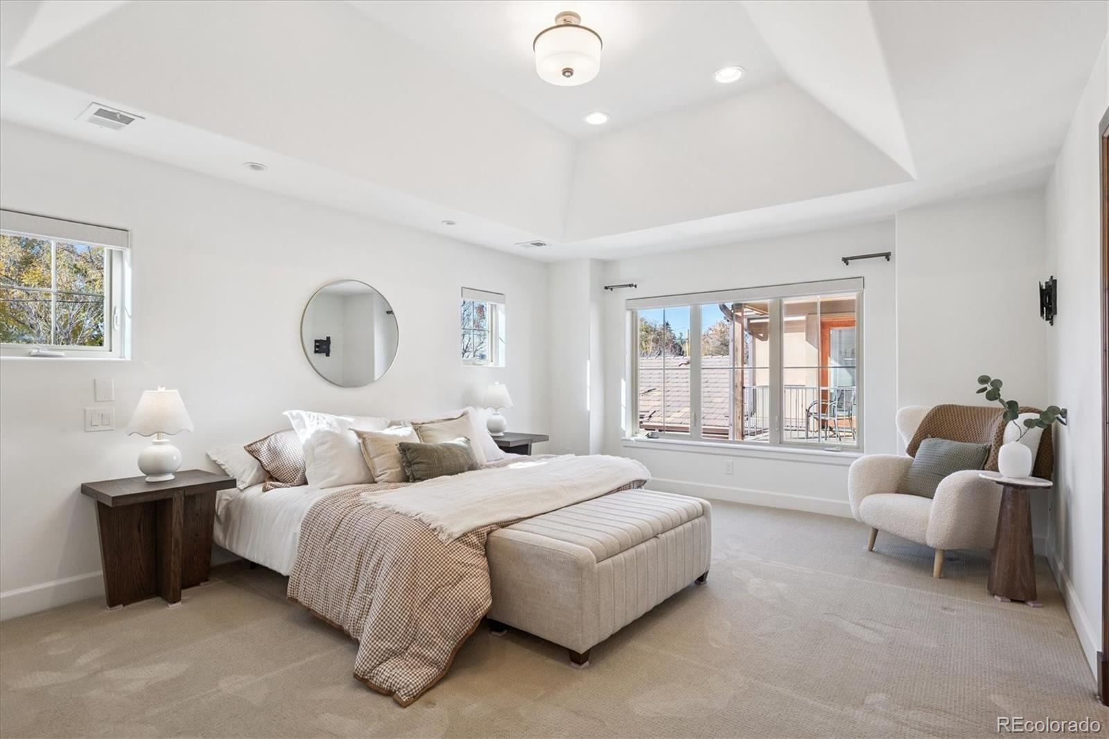 2415 South Madison Street Denver, CO 80210 - Photo 22 of 37 a bedroom with bed and a large window