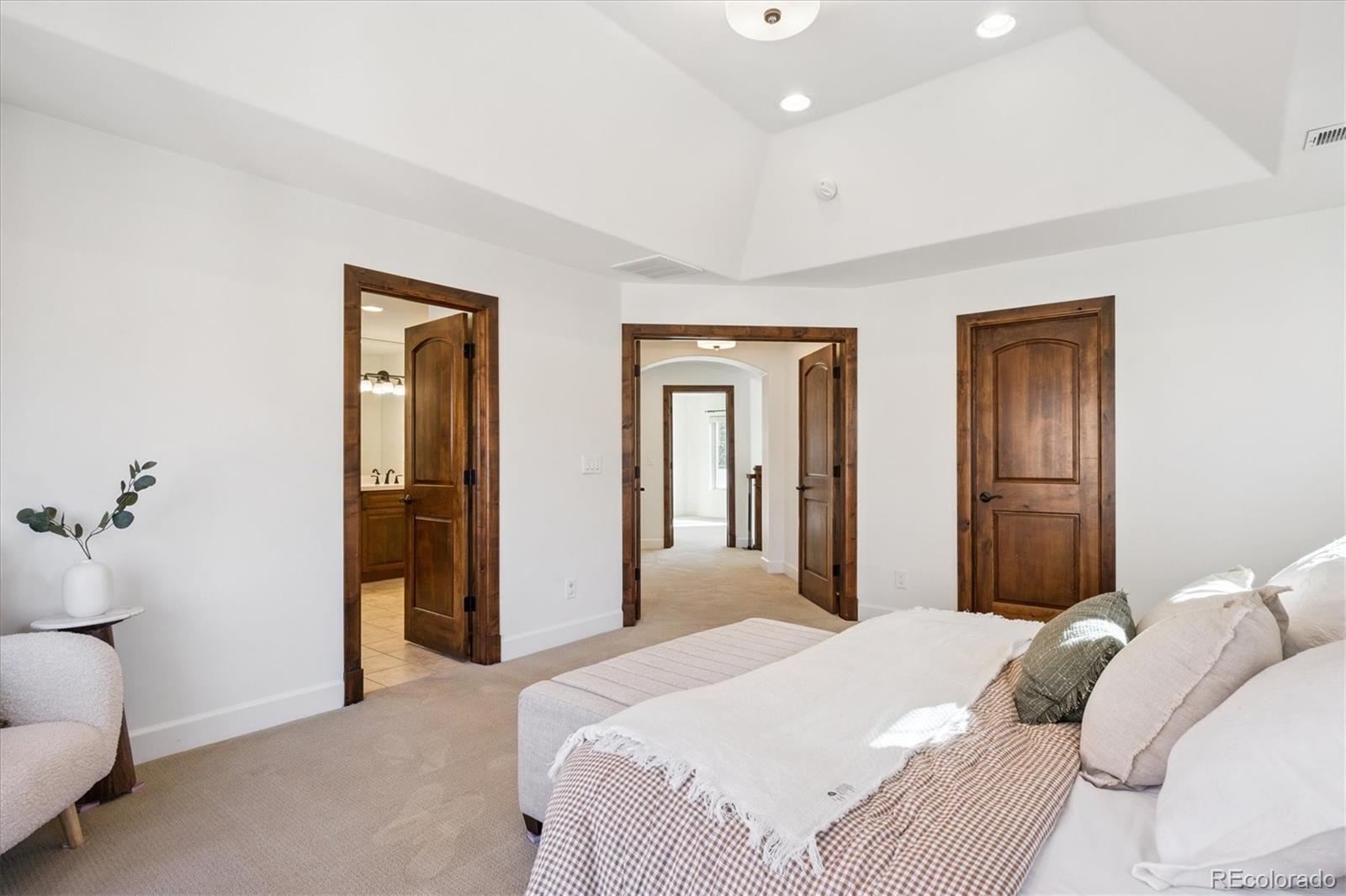 2415 South Madison Street Denver, CO 80210 - Photo 23 of 37 a bedroom with a large bed and closet