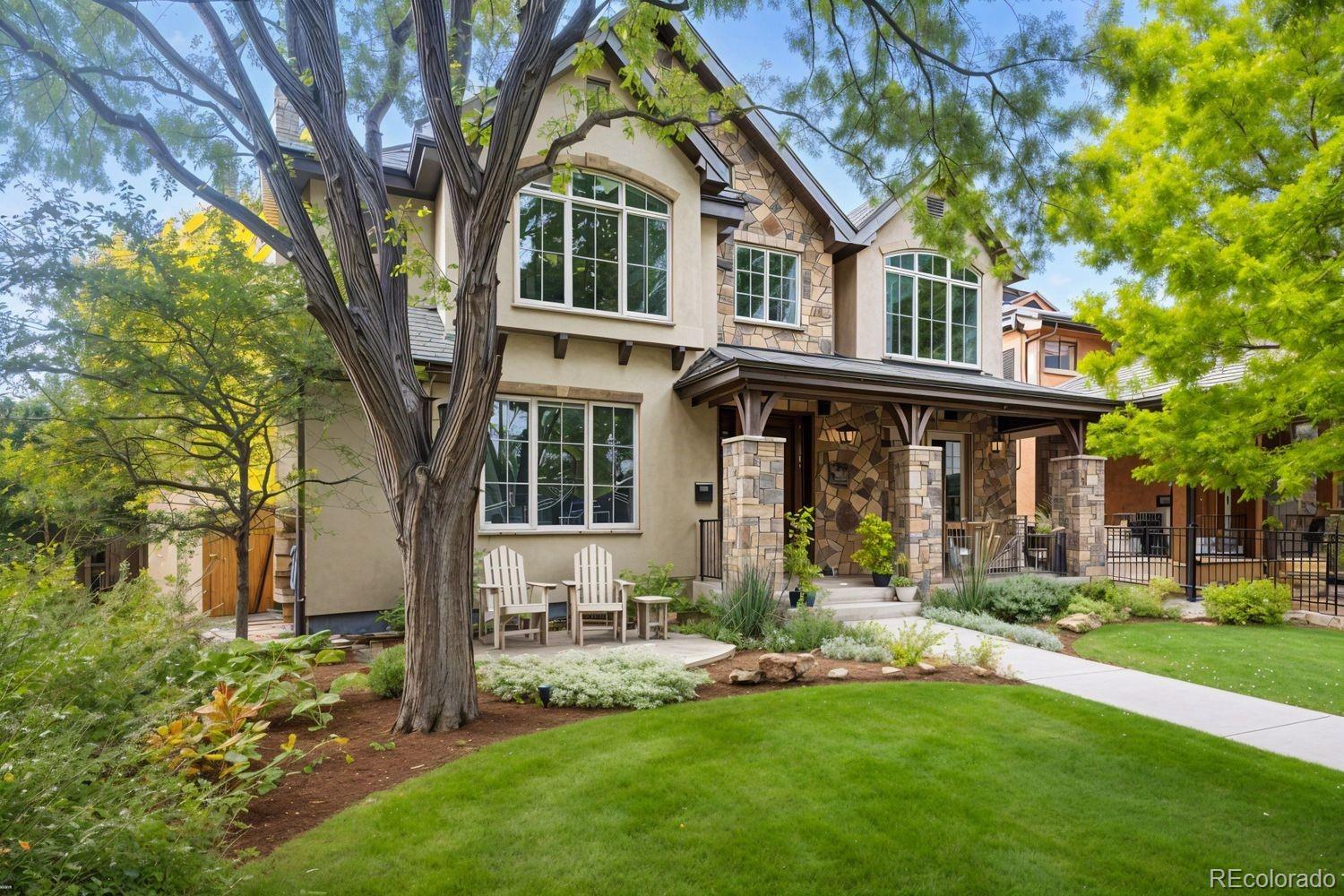 2415 South Madison Street Denver, CO 80210 - Photo 37 of 37 a front view of a house with a yard table and chairs