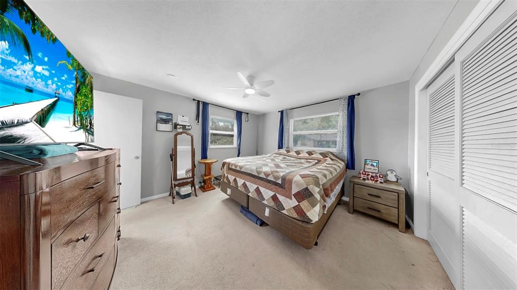 38919 3rd Avenue Zephyrhills, FL 33542 - Photo 13 of 36 a bedroom with a bed and a window