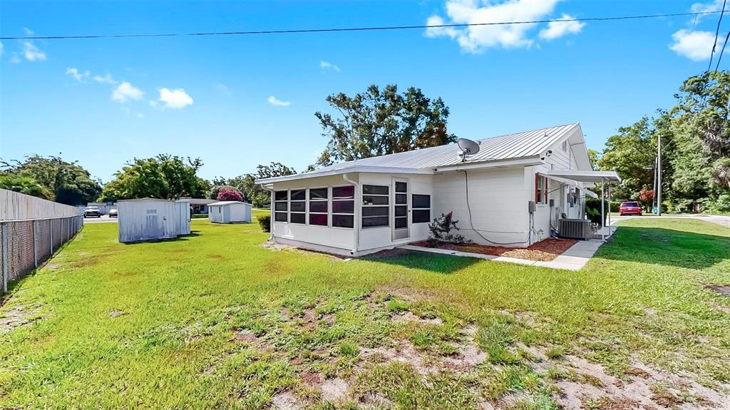 38919 3rd Avenue Zephyrhills, FL 33542 - Photo 24 of 36 a view of a house with backyard and sitting area