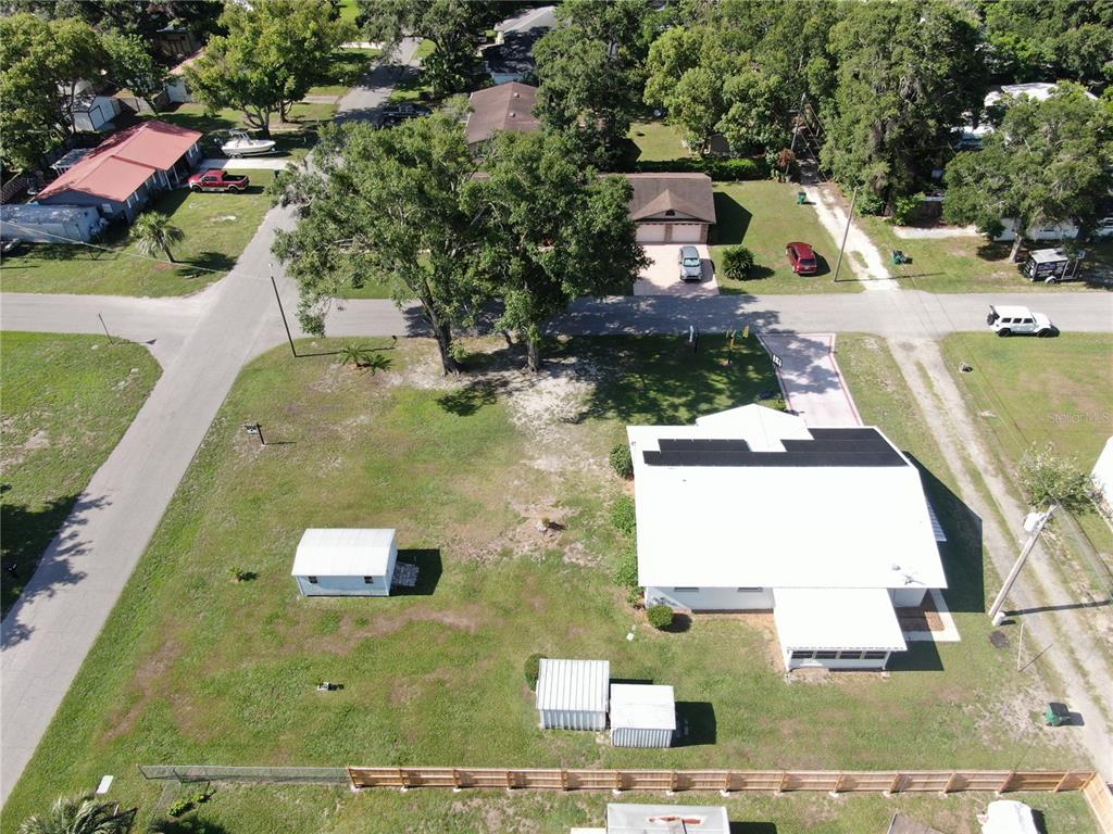 38919 3rd Avenue Zephyrhills, FL 33542 - Photo 27 of 36 an aerial view of a house with a swimming pool