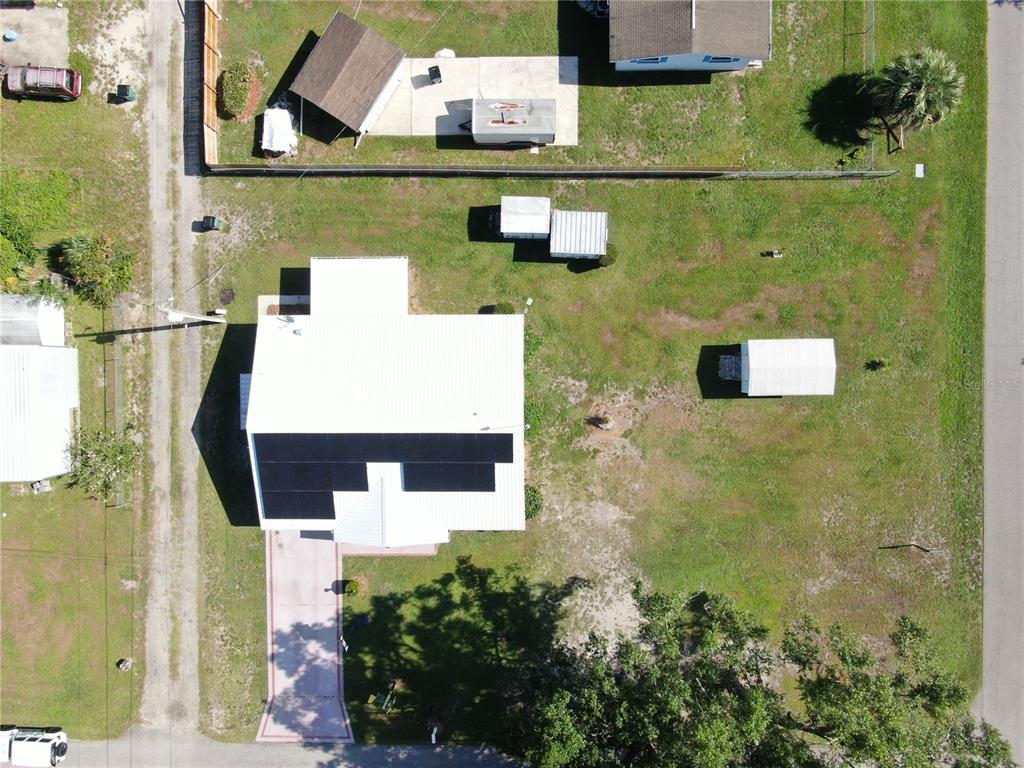 38919 3rd Avenue Zephyrhills, FL 33542 - Photo 28 of 36 an aerial view of a house with a yard