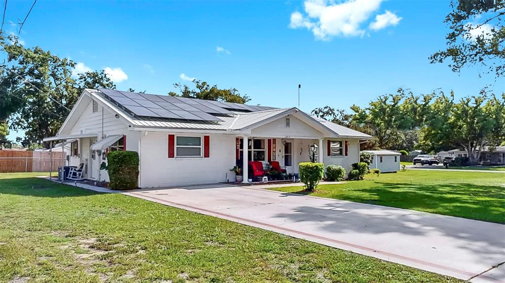 38919 3rd Avenue Zephyrhills, FL 33542 - Photo 32 of 36 a view of a house with a yard and plants