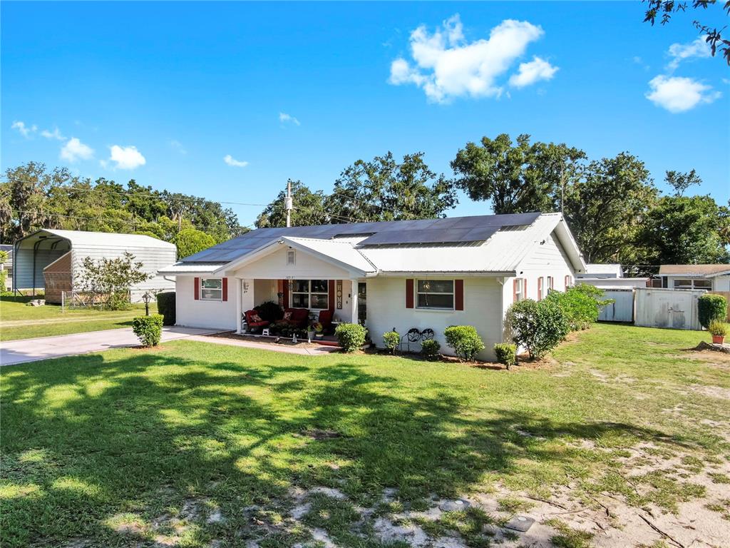 38919 3rd Avenue Zephyrhills, FL 33542 - Photo 34 of 36 a view of a house with a yard porch and sitting area