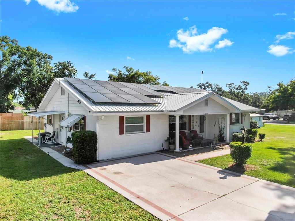 38919 3rd Avenue Zephyrhills, FL 33542 - Photo 35 of 36 a front view of a house with yard
