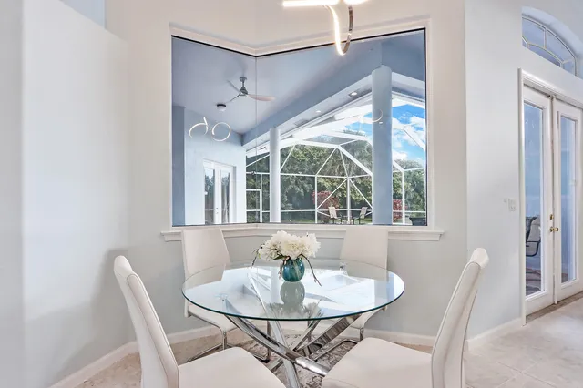a dining room with furniture and window