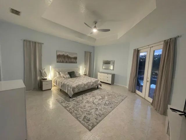 a bedroom with a large bed and a couch