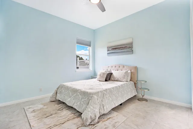 a bathroom with a toilet a sink and a mirror