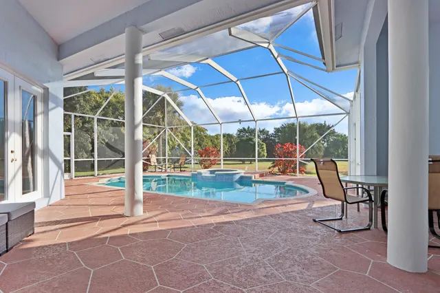 a view of a swimming pool with a porch