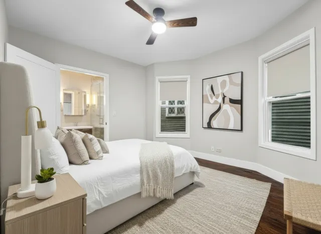 a bedroom with bed and a window