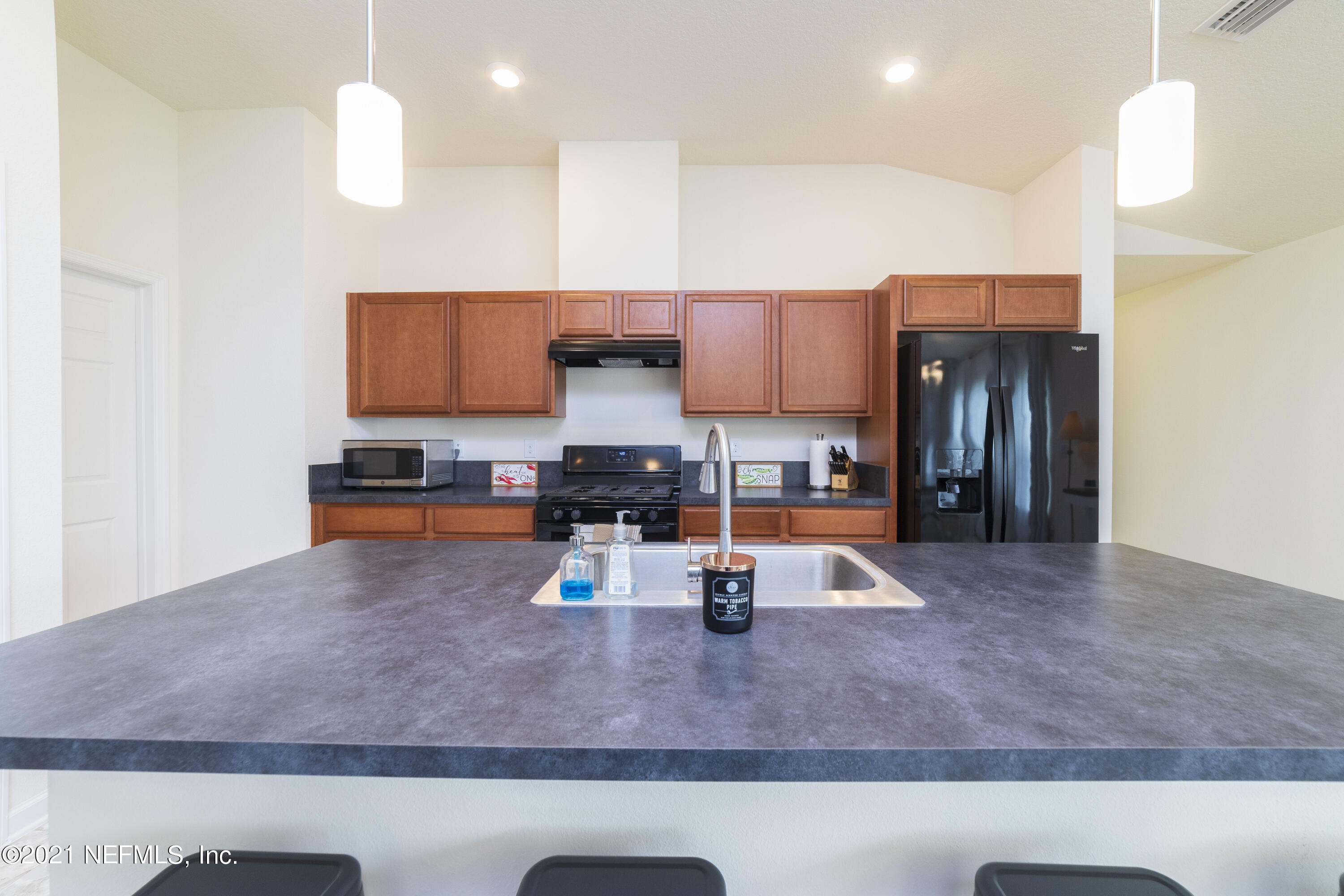 313 Bluejack Lane St. Augustine, FL 32095 - Photo 36 of 51 Bar to Kitchen