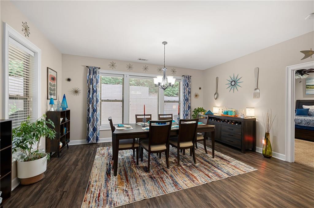 102 Kirk Drive Dallas, GA 30132 - Photo 12 of 28 a view of a dining room with furniture and wooden floor