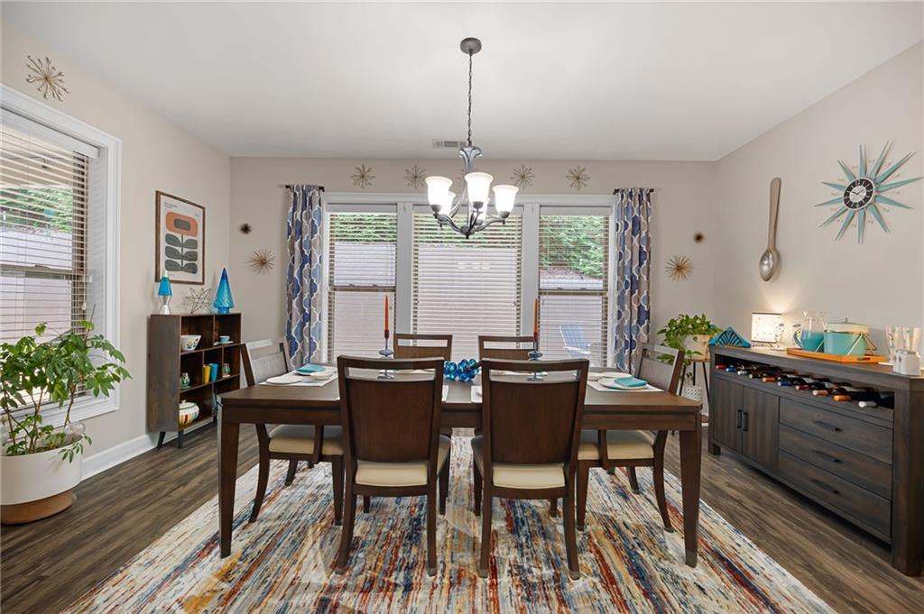 102 Kirk Drive Dallas, GA 30132 - Photo 13 of 28 a view of a dining room with furniture window and wooden floor
