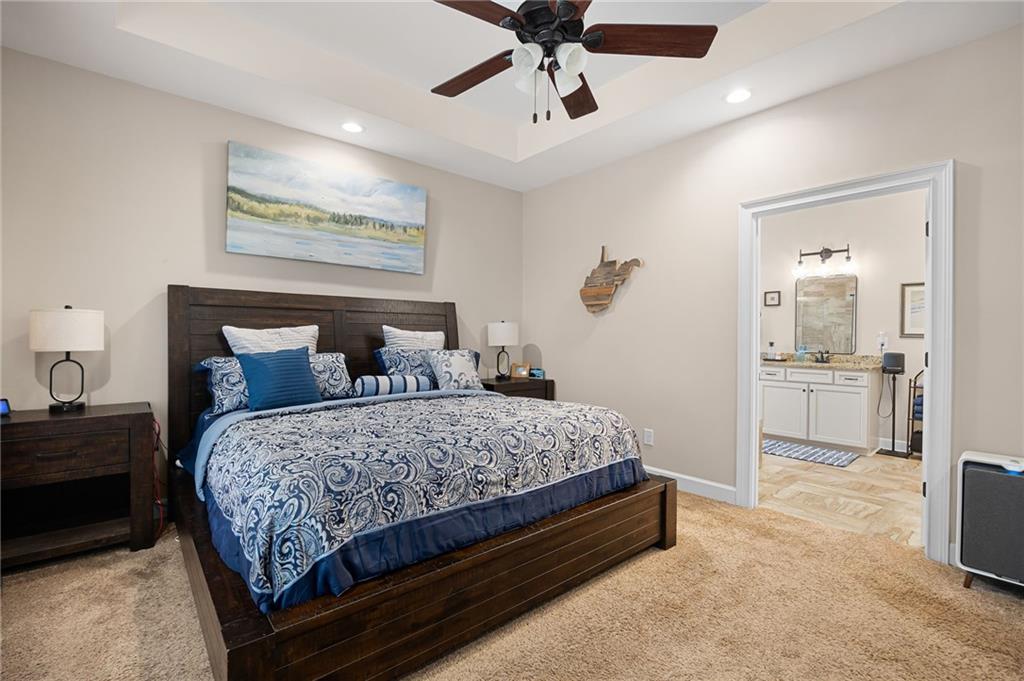 102 Kirk Drive Dallas, GA 30132 - Photo 15 of 28 a bedroom with a large bed and a chandelier