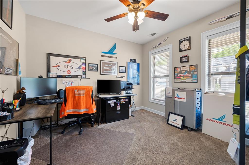 102 Kirk Drive Dallas, GA 30132 - Photo 20 of 28 a view of a workspace with furniture and a window