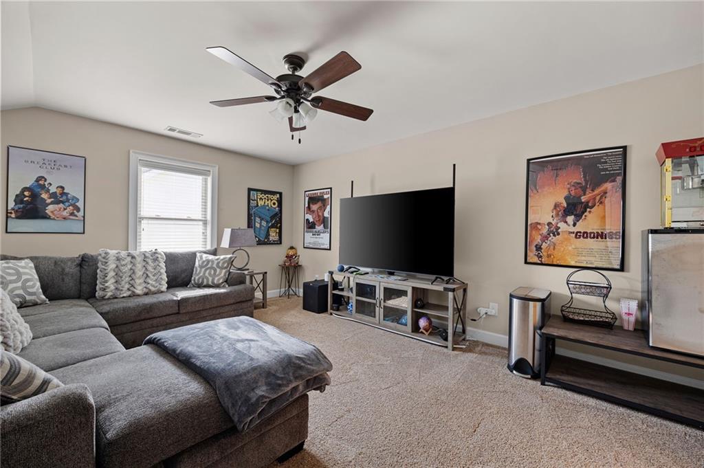 102 Kirk Drive Dallas, GA 30132 - Photo 22 of 28 a living room with furniture and a flat screen tv
