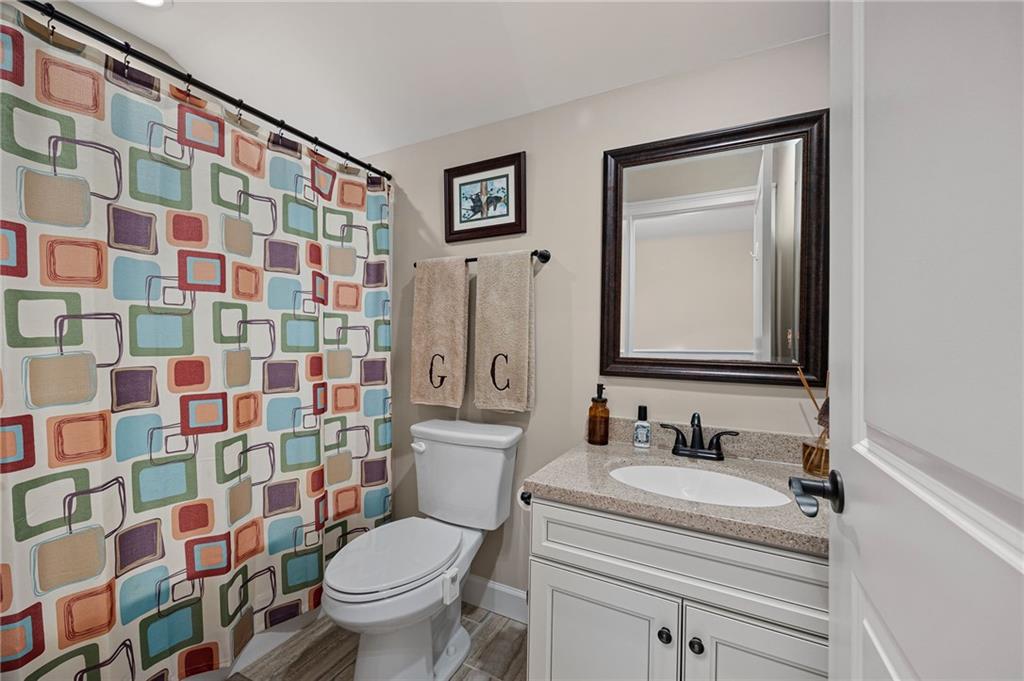 102 Kirk Drive Dallas, GA 30132 - Photo 23 of 28 a bathroom with a sink toilet and shower